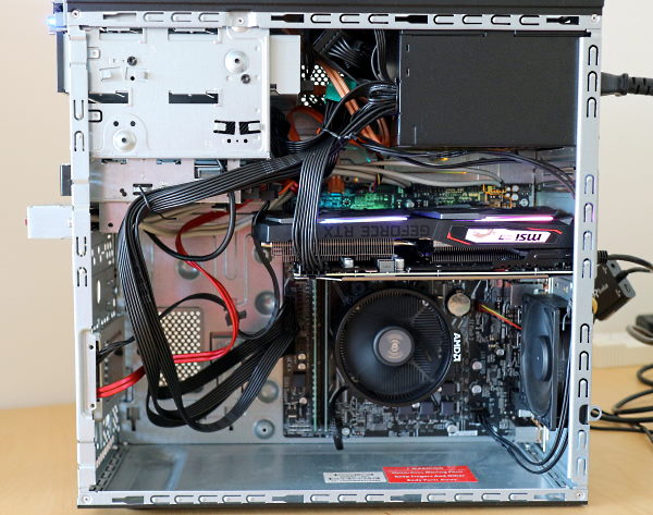 Interior of computer showing components including motherboard, power supply, graphics card, etc.